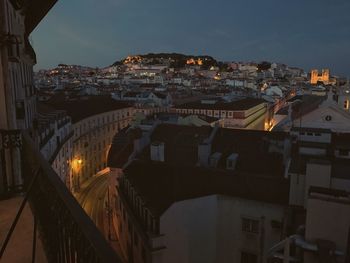 High angle view of buildings in city at night