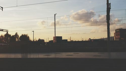 Silhouette buildings against sky during sunset