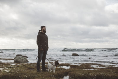 Man with dog at sea