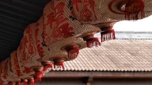 Low angle view of lanterns hanging from roof