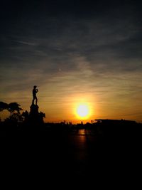 Silhouette landscape against sky during sunset