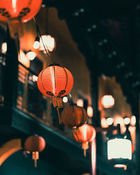 Low angle view of illuminated lanterns hanging outdoor