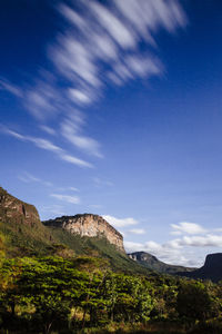 Scenic view of mountains against cloudy sky