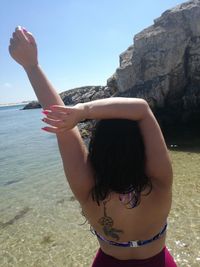 Midsection of woman at beach