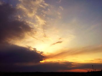 Scenic view of dramatic sky at sunset