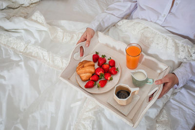 High angle view of breakfast served on bed