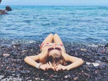 Woman relaxing on beach