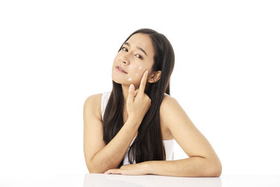 Portrait of a beautiful young woman over white background
