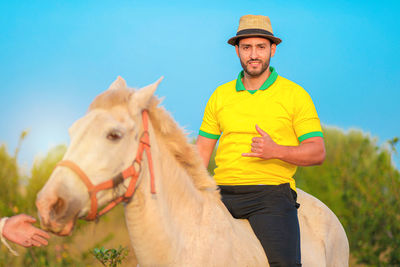 Portrait of woman riding horse