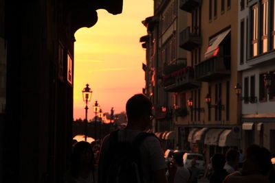 Buildings in city at sunset