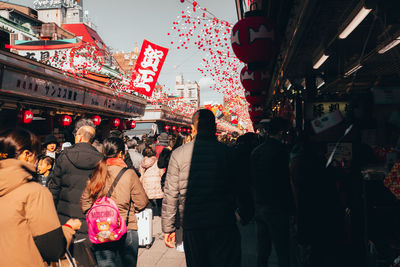 People walking on street in city
