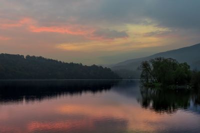 Scenic view of lake against sky during sunset