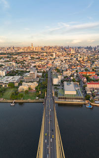 High angle view of road by buildings against sky