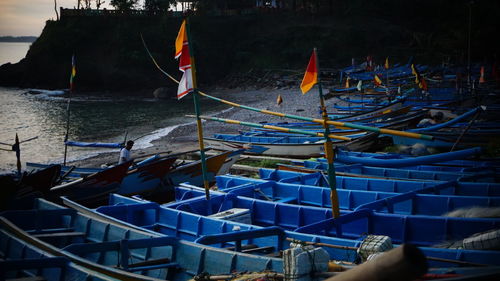 Fishing boats moored at harbor