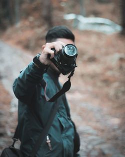 Midsection of man photographing