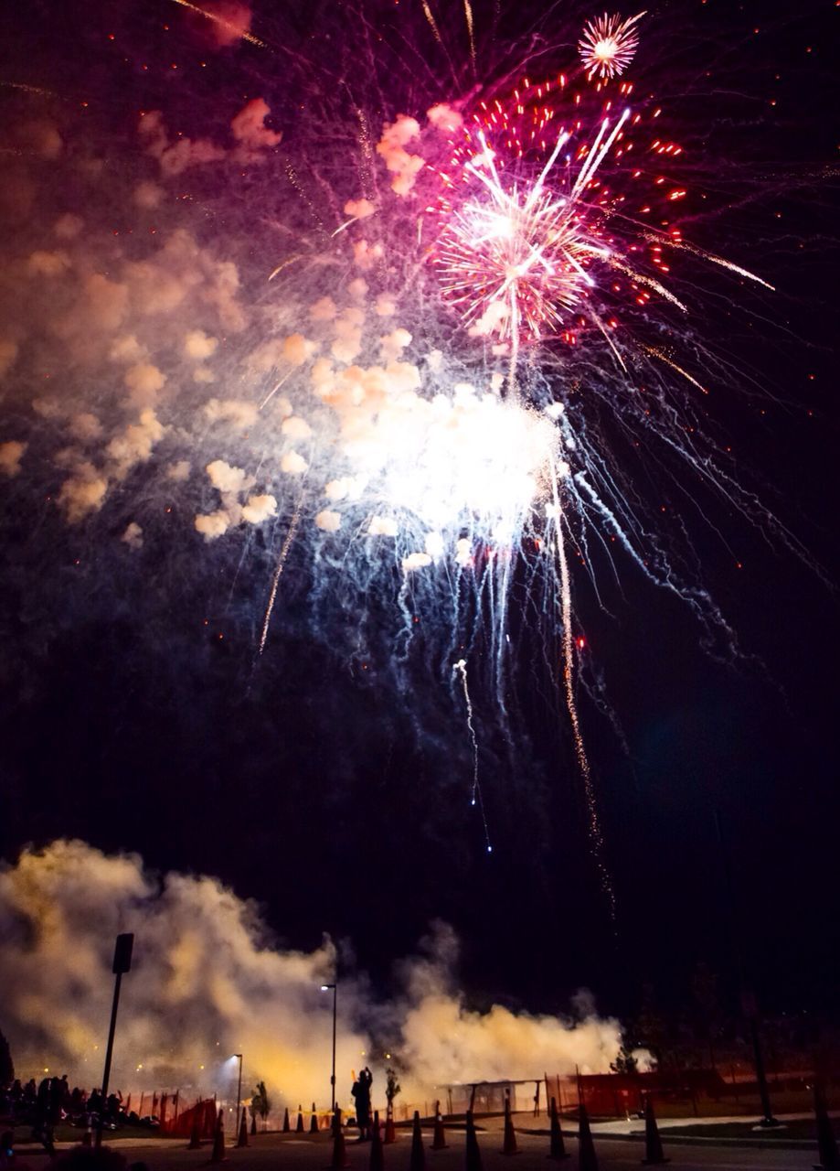 night, arts culture and entertainment, illuminated, firework display, celebration, long exposure, exploding, firework - man made object, sparks, motion, event, low angle view, glowing, sky, firework, entertainment, blurred motion, celebration event, multi colored, fire - natural phenomenon