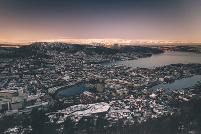 High angle view of town against sky during sunset