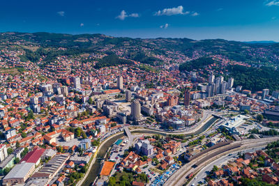 High angle view of illuminated cityscape against sky