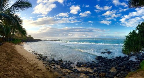 Scenic view of sea against cloudy sky