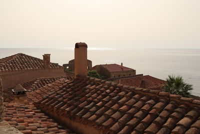 High angle view of building by sea against clear sky