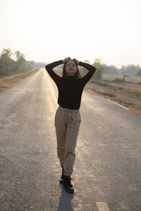 Portrait of man standing on road