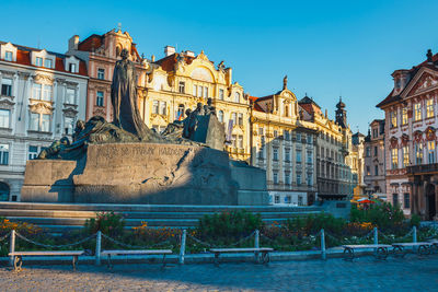 Buildings in city against clear sky
