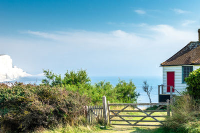 Coastguard cottage by the sea against the seven sisters cliffs and blue sky at east sussex