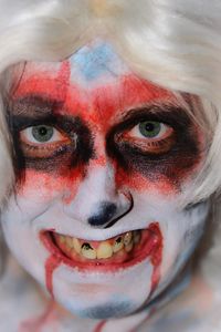 Close-up portrait of smiling young woman with eyes closed