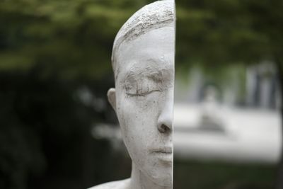 Close-up of statue in cemetery