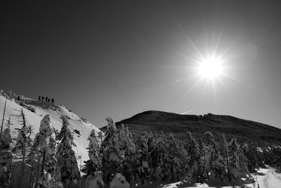 Low angle view of snowcapped mountain against sky