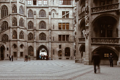 People walking in historic building