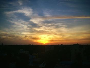 High angle view of city at sunset