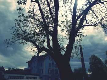 Low angle view of building against cloudy sky