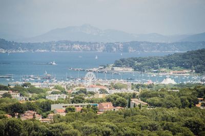 High angle view of townscape by sea