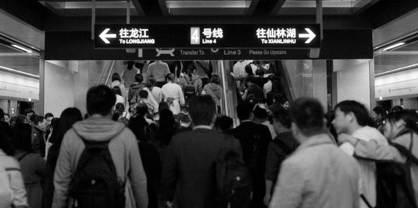 Group of people at railroad station