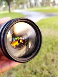 Close-up of hand holding camera
