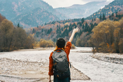 Rear view of man standing on mountain