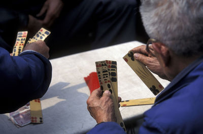 Men playing cards at table