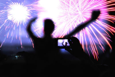 Firework display at night