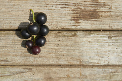 High angle view of grapes on wooden table
