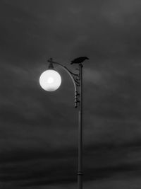 Low angle view of street light against sky