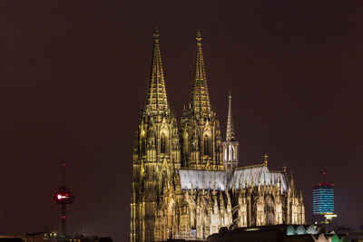 Illuminated buildings in city at night