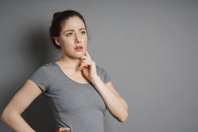 Portrait of a beautiful young woman over white background