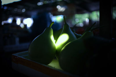 Close-up of illuminated candles on table at home