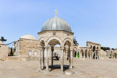 View of historical building against clear blue sky