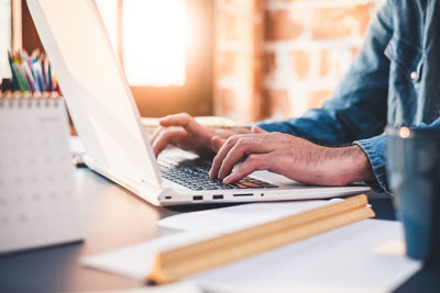 Man using laptop on table