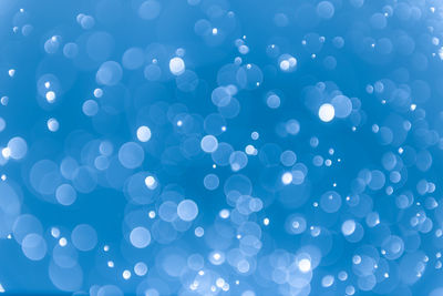 Defocused image of illuminated blue lights