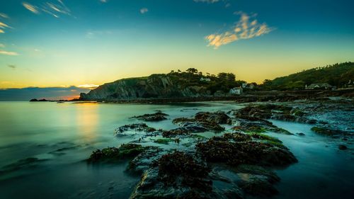 Scenic view of sea against sky during sunset