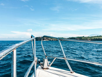 Sailboat sailing on sea against sky