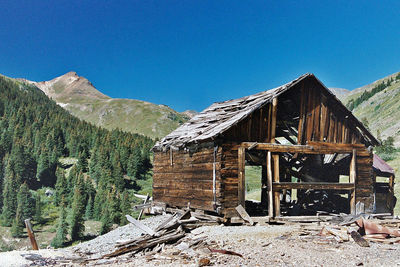 Built structure on landscape against sky